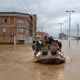 Military rescue boats search for survivors in Aq Qala, Iran.